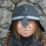 Child wearing the Vah Black Alamann Knight Helmet