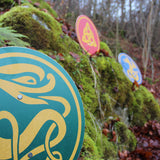 Vah Celtic Sigar Wooden Shield pictured outdoors with 2 other Celtic shields in the background
