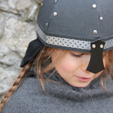 Child wearing the Vah Black Alamann Knight Helmet