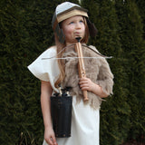 Child wearing the Vah Gallic Roman Helmet holding a crossbow