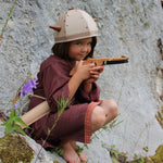 Child playing with the Vah Junior Wooden Bow toy