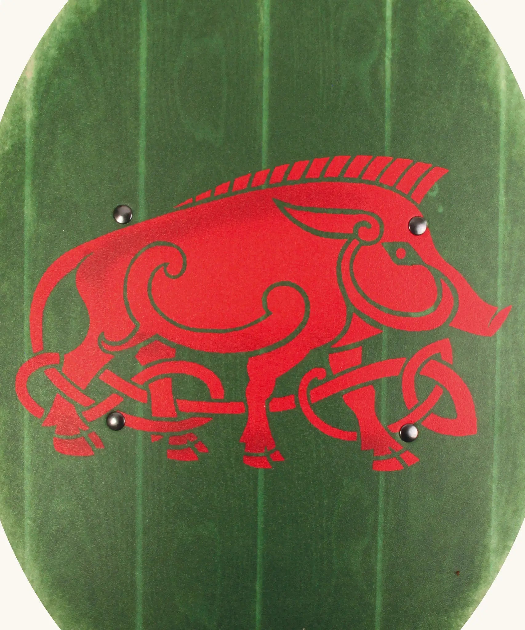 VAH green wooden curved shield showing a close up of a large Celtic warthog design in red on the front 