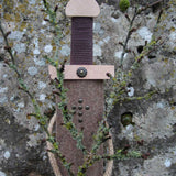 Vah Excalibur Wooden Sword Set pictured outdoors with sword inside woolen felted  sheath