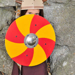 Child wearing a viking costume behind a Vah Grimwald Round Wooden Shield - Red & Yellow