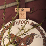 Vah Hugin & Munin Viking Round Wooden Shield with mossy branches laid on top