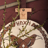 Vah Hugin & Munin Viking Round Wooden Shield with mossy branches laid on top