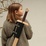 child wearing a sword on their back using the vah konrad back sword holder