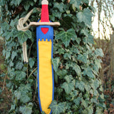 Vah Landsknecht Yellow & Blue Wooden Sword Set pictured on an ivy covered tree