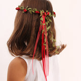 Child wearing the Vah red Flower Crown. View of back of child's head