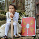Child sitting on a step outdoors