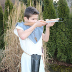 Child wearing the Vah Spartacus Roman Tunic using a crossbow