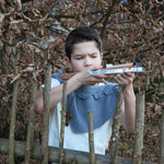 Child in fancy dress taking aim with the Vah Wooden Hunting Crossbow with Safety Arrows