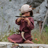 Child playing with the Vah Junior Wooden Bow toy