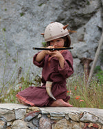 Child playing with the Vah Junior Wooden Bow toy