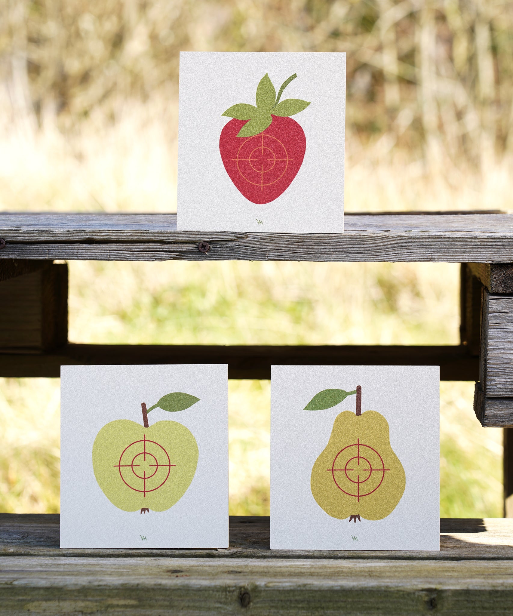 Vah Wooden Fruit Target Trio for Safety Arrows. One target has a strawberry, one has an apple and the third has a pear. 