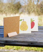 Vah Wooden Fruit Target Trio for Safety Arrows. One target has been turned around to stand to show the wooden base that allows the targets to be freestanding. 