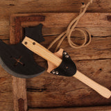 Vah Wooden Splendor Axe placed on a wooden surface in a holder