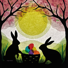 A Toverlux silhouette with 2 bunny rabbits standing next to a basket full of coloured eggs under a blossom tree. This layered paper style silhouette is by artist Vogel Geluk and available at Babipur.
