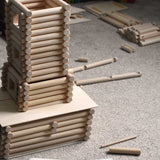 A tower part way built using pieces from the Walachia Vario XL Building Set 184 Pieces.  This modular wooden building block system is perfect for those who enjoy a challenge. The sets are available in various sizes at Babipur.  