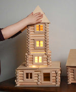 A tower built using pieces from the Walachia Vario XL Building Set 184 Pieces.  This modular wooden building block system is perfect for those who enjoy a challenge. The sets are available in various sizes at Babipur.  