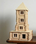 A tower built using pieces from the Walachia Vario XL Building Set 184 Pieces.  This modular wooden building block system is perfect for those who enjoy a challenge. The sets are available in various sizes at Babipur.  