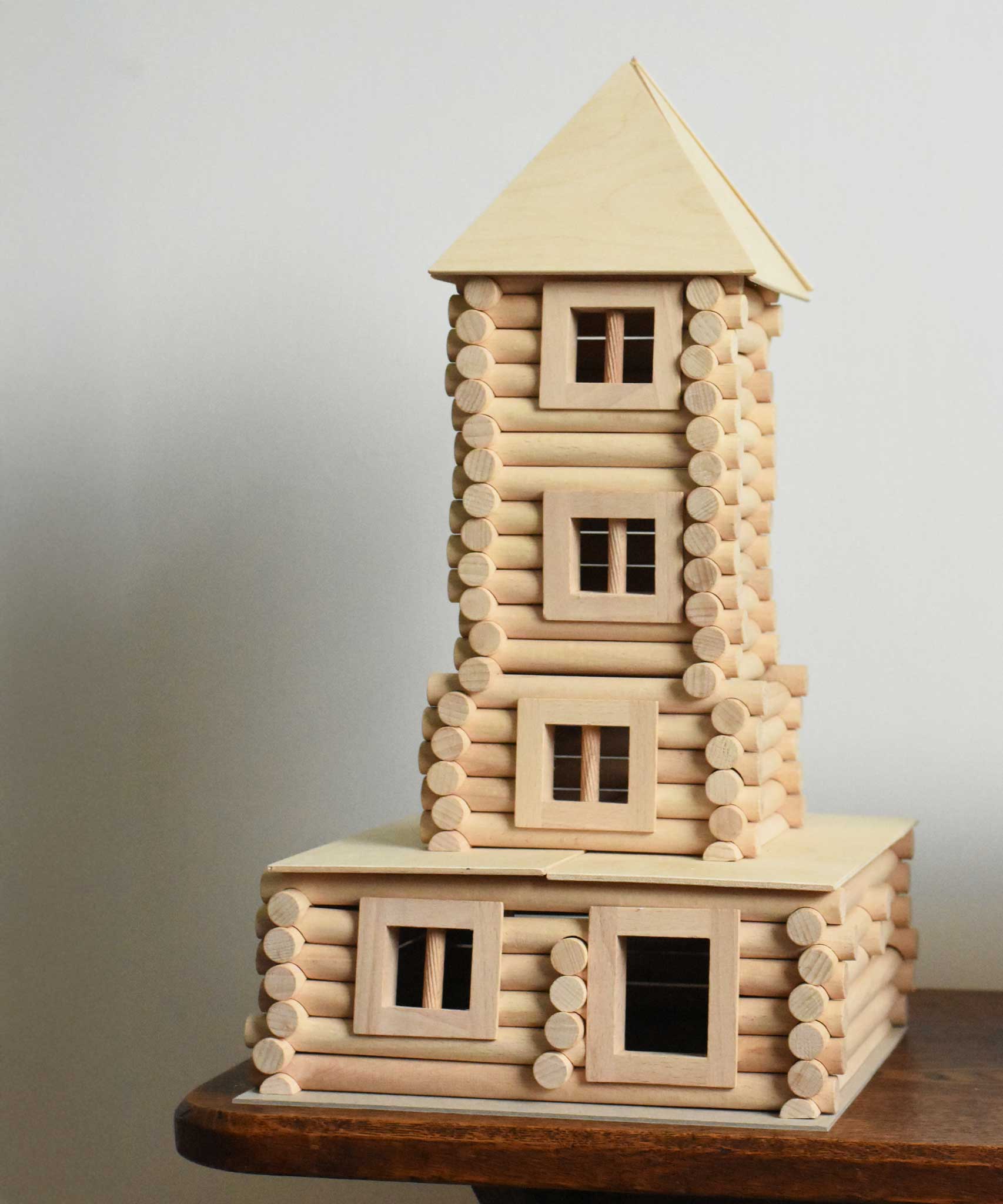 A tower built using pieces from the Walachia Vario XL Building Set 184 Pieces.  This modular wooden building block system is perfect for those who enjoy a challenge. The sets are available in various sizes at Babipur.  