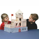 Two children looking at the fort build created using the Walachia Vario Fort Building Set 194 Pieces. This modular wooden building block system is perfect for those who enjoy a challenge. The sets are available in various sizes at Babipur. 