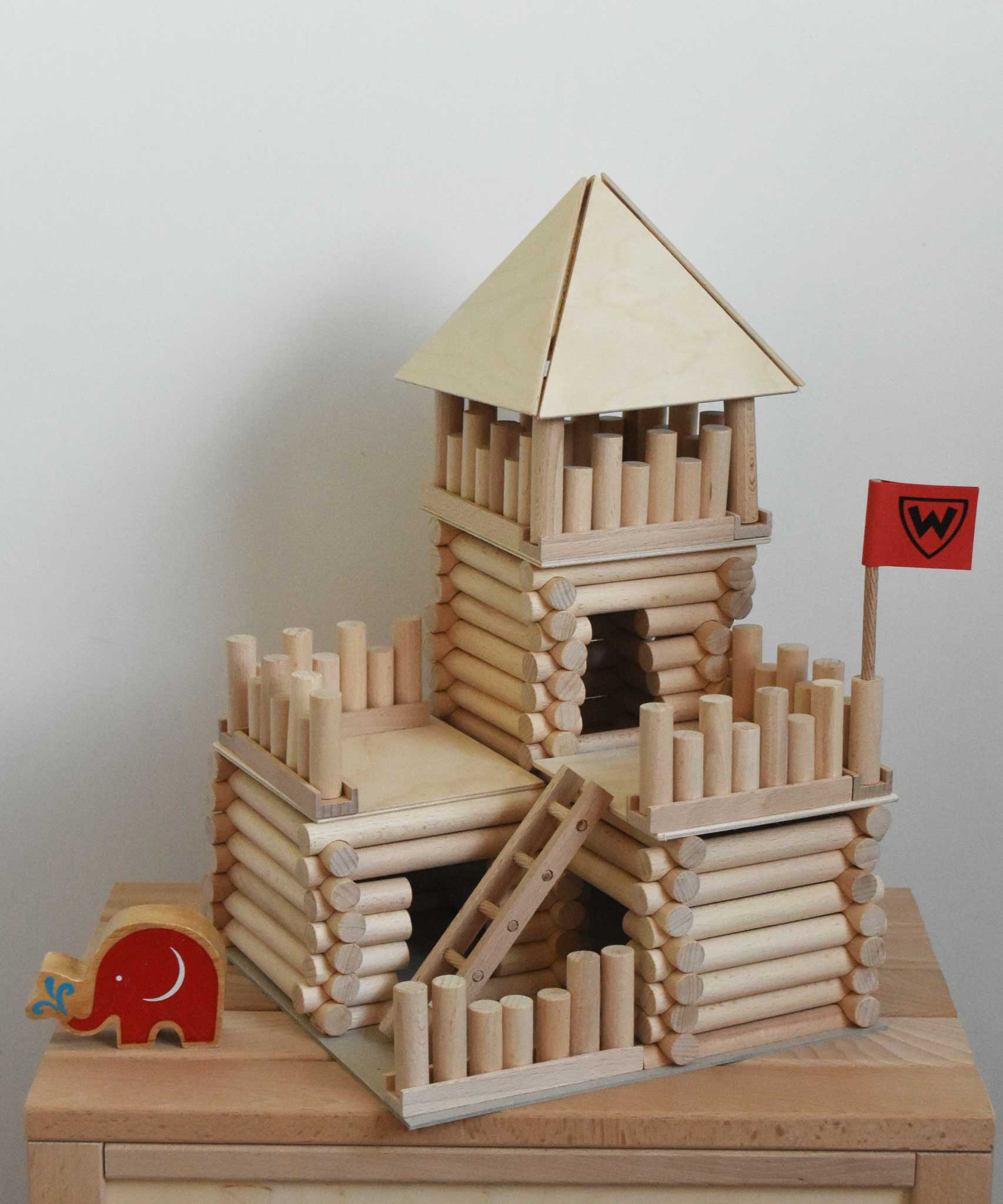 A fort build created using the Walachia Vario Fort Building Set 194 Pieces. A Babipur Lanka Kade elephant figure has been placed besides the build. This modular wooden building block system is perfect for those who enjoy a challenge. The sets are available in various sizes at Babipur. 