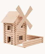 A wind mill built using the Walachia Vario Mill Wooden Building Set 122 Pieces. This modular wooden building block system is perfect for those who enjoy a challenge. The sets are available in various sizes at Babipur.  