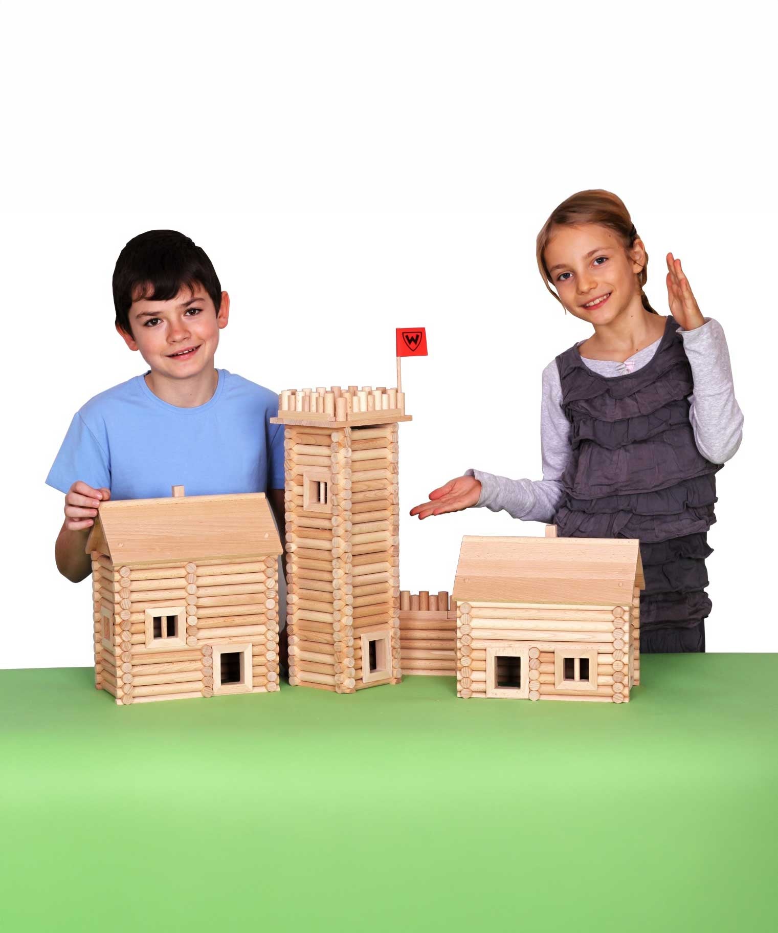 Children standing by build created using the wooden pieces from the Walachia Vario Massive Box Wooden Building Set 418 Pieces.