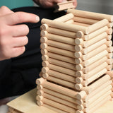 A close up of a  structure being built using Walachia Vario logs. This modular wooden building block system is perfect for those who enjoy a challenge. The sets are available in various sizes at Babipur.  