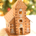 A beautifully festively decorated WALACHIA Church Hobby kit. The natural wood grain shows through on all wooden pieces and is decorated with white painted roof tiles