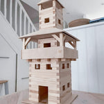 A carefully crafted WALACHIA Tower. The wooden blocks showing their natural grain sit perfectly after being glued together