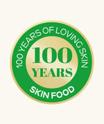 A green and gold  roundel showing 100 years of loving skin food from Weleda