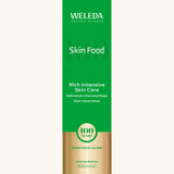A green and gold limited edition box for the Weleda 100ml skin food tube