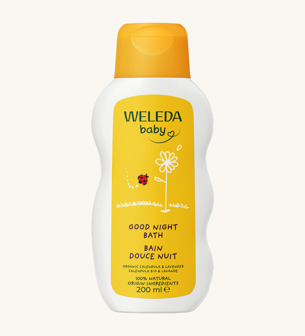 Weleda Baby Good Night Bath Soak in a white bottle, with yellow label highlighting 100% natural ingredients and organic calendula and lavender
