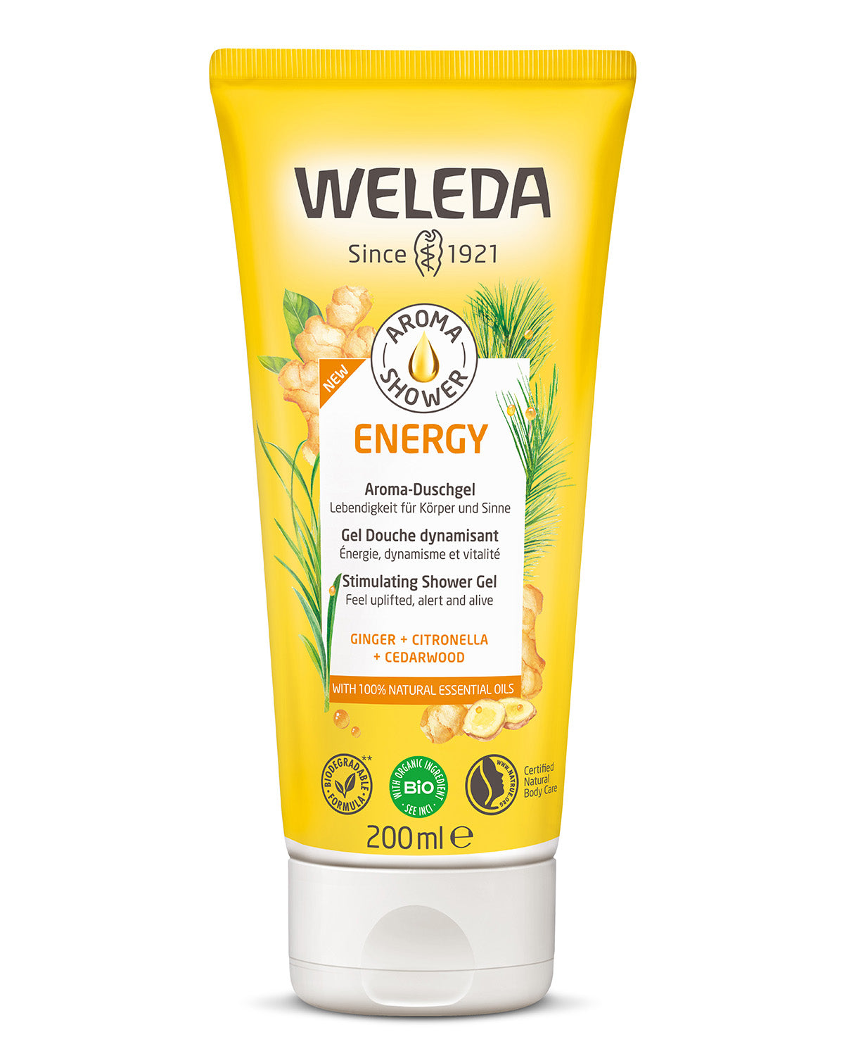 Weleda Energy Aroma Shower Gel 200ml a yellow tubes of natural ginger shower gel in an adults hand