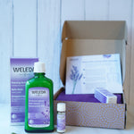Weleda Relax & Unwind Wellbeing Gift Set - Lavender.  This luxurious lavender gift set includes Lavender Relaxing Bath Milk 200ml and a mini Lavender Relaxing Body Oil 10ml. Also pictured is the eco friendly and decorated cardboard box packaging and a sel