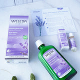 Weleda Relax & Unwind Wellbeing Gift Set - Lavender.  This luxurious lavender gift set includes Lavender Relaxing Bath Milk 200ml and a mini Lavender Relaxing Body Oil 10ml. Also pictured is the bath milk and oil packaging packaging and a self care sheet.