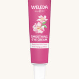 Weleda wild rose  and white tea soothing eye cream. Showing a pink tube with branding on the front and features a white cap.