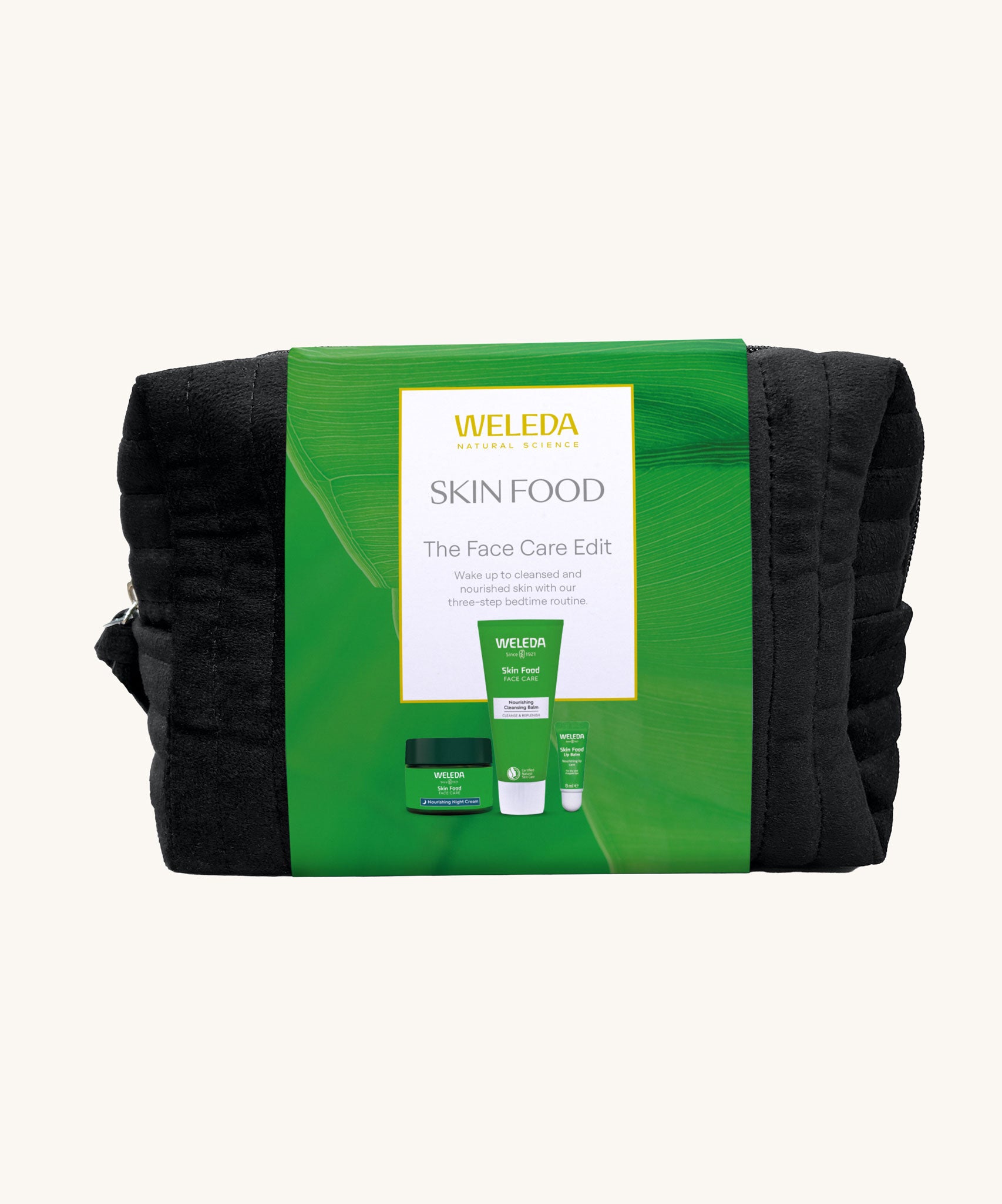 Weleda Skin Food - The Face Care Edit Gift Set. A Weleda gift set that includes the Skin Food nourishing cleansing balm, lip balm and night cream, all presented in a make up bag. Weleda have a range of luxurious, natural skin care items available at Babipur. 