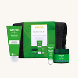 Weleda Skin Food - The Face Care Edit Gift Set. A Weleda gift set that includes the Skin Food nourishing cleansing balm, lip balm and night cream, all presented in a make up bag. Weleda have a range of luxurious, natural skin care items available at Babipur. 