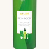 Weleda Skin Food The Glow Up Gift Set. A gift set that contains the Weleda Skin Food ultra light dry oil. lip balm and skin food original all presented in a cylinder shaped tube. Weleda have a range of luxurious, natural skin care items available at Babipur.  