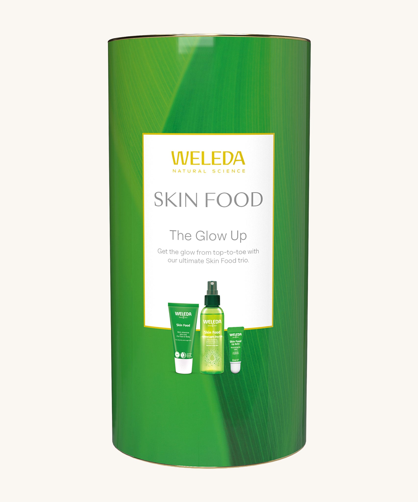 Weleda Skin Food The Glow Up Gift Set. A gift set that contains the Weleda Skin Food ultra light dry oil. lip balm and skin food original all presented in a cylinder shaped tube. Weleda have a range of luxurious, natural skin care items available at Babipur.  