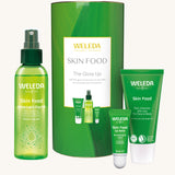 Weleda Skin Food The Glow Up Gift Set. A gift set that contains the Weleda Skin Food ultra light dry oil. lip balm and skin food original all presented in a cylinder shaped tube. Weleda have a range of luxurious, natural skin care items available at Babipur.  