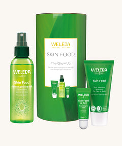 Weleda Skin Food The Glow Up Gift Set. A gift set that contains the Weleda Skin Food ultra light dry oil. lip balm and skin food original all presented in a cylinder shaped tube. Weleda have a range of luxurious, natural skin care items available at Babipur.  