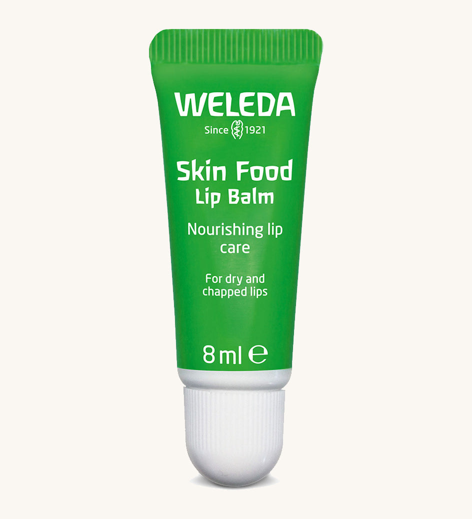 Weleda 8ml skin food natural lip balm available at Babipur. This comes in a green tube with a white cap 