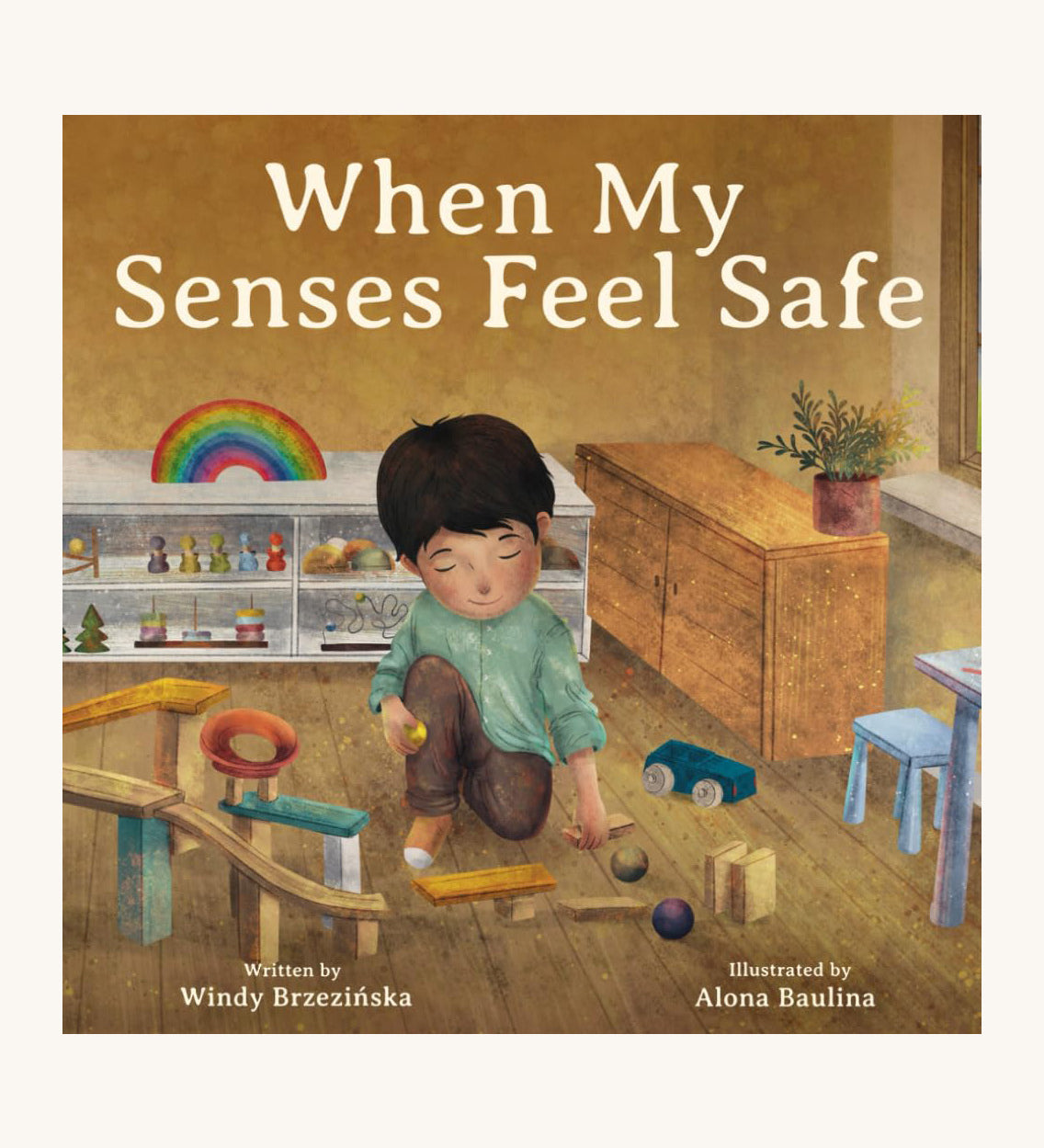 The front cover of When My Senses Feel Safe By Windy Brzezinska. A beautifully illustrated children's story book, with the cover showing a child in a playing with ball run pieces in a playroom 