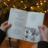 A person holding open the Where The Forest Once Stood - Children's Poetry Anthology by Julie Hare book open. This book is part of a range of children's books available at Babipur. 