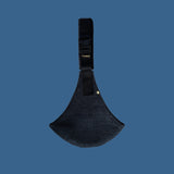 The black corduroy Wildride toddler carrier sling, on a blue background. 